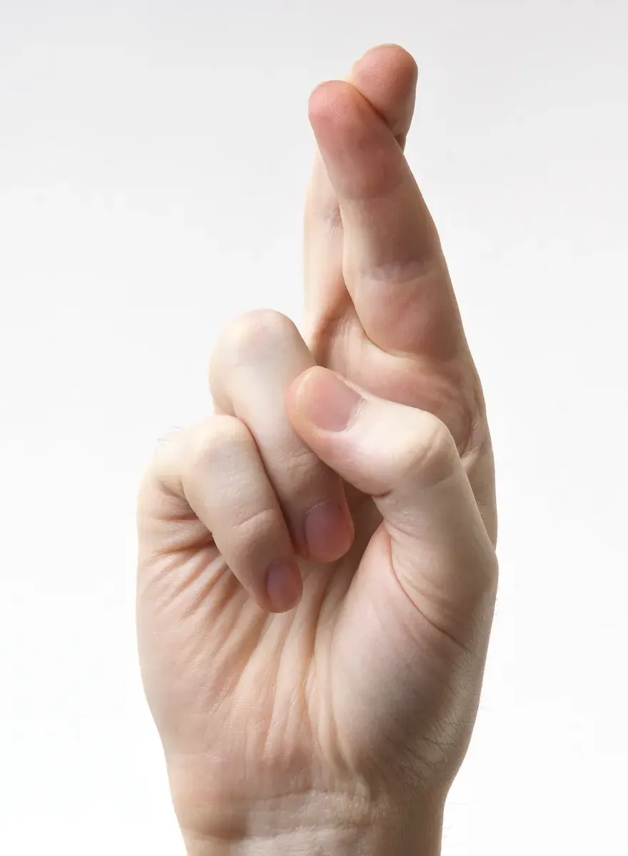 The Crossed fingers card